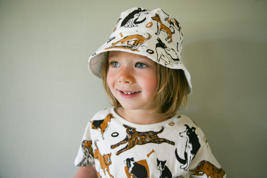 Dog pattern bucket hat. Labrador bucket hat poodle bucket hat, corgi bucket hat, papillon bucket hat, German shepherd bucket hat, Chihuahua bucket hat, bulldog bucket hat, french bulldog bucket hat, Basset bucket hat, Greyhound bucket hat, beagle sweatshirt, boxer sweatshirt. Name a dog and you'll find it on that bucket hat. Organic cotton bucket hat.